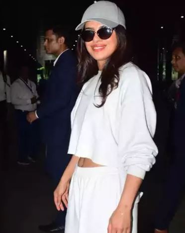 Desi girl spotted at Mumbai airport wearing track pants with white crop top